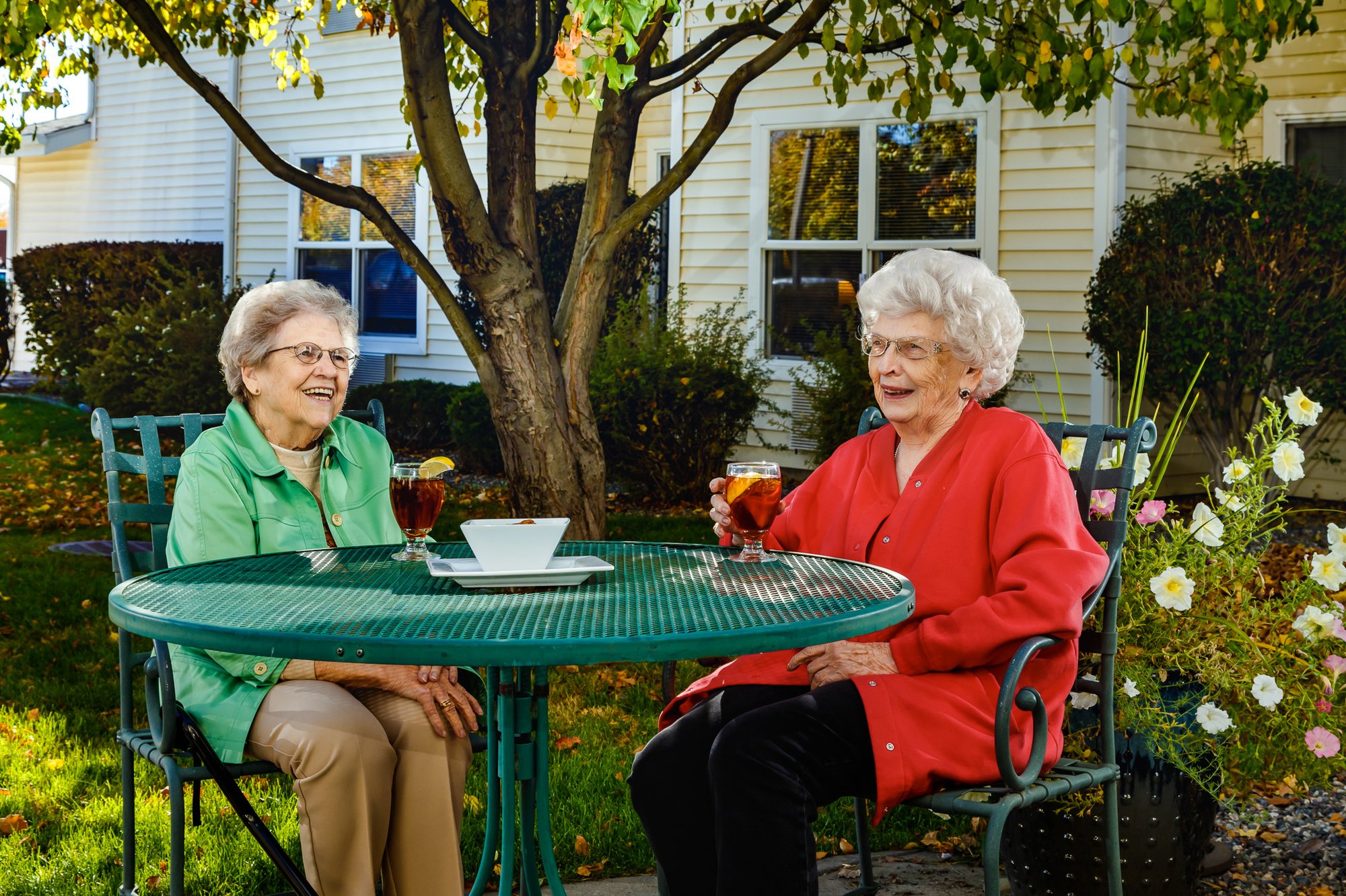 Two ladies having drinks and a conversation