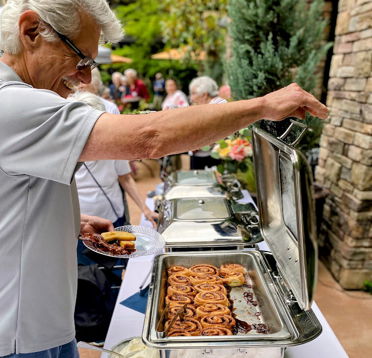 Older man enjoying some catered food