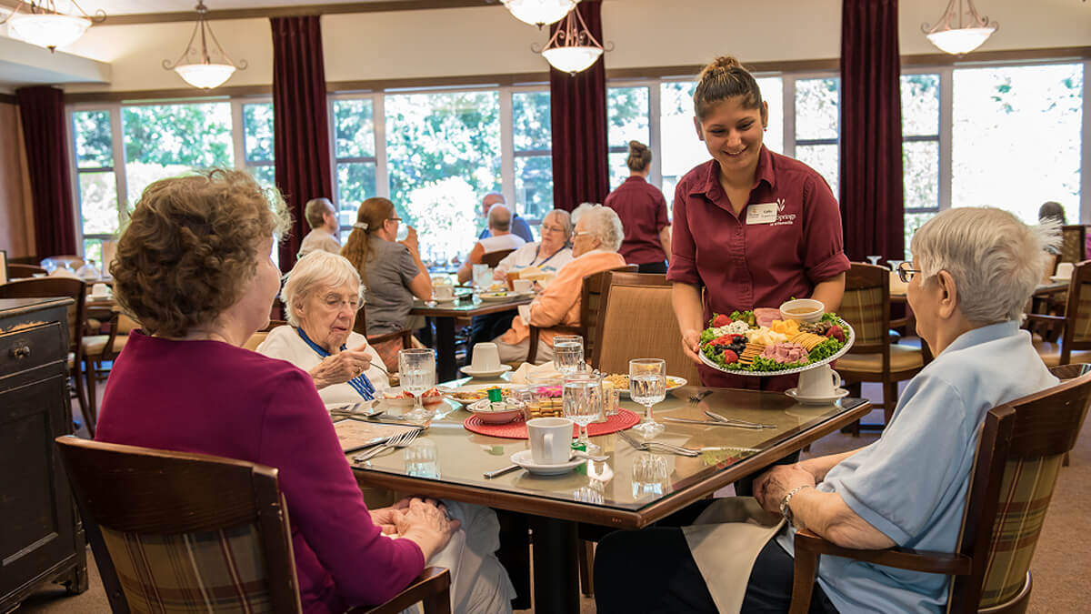 Residents in the dining room at the Wilsonville community