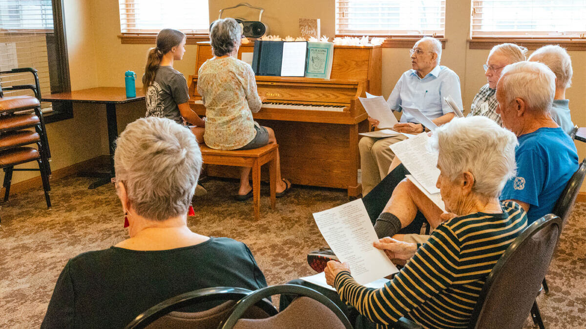 Residents enjoying choir practice at the Missoula community