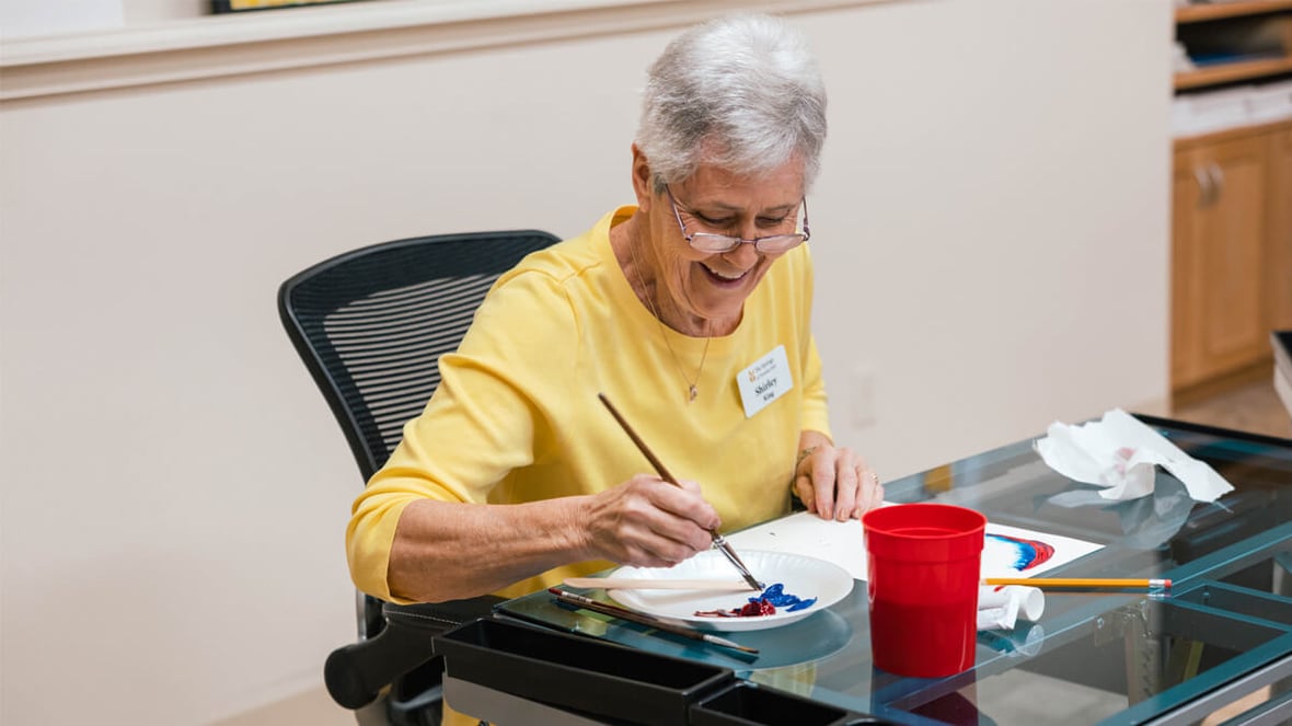 Resident painting at the Veranda Park community