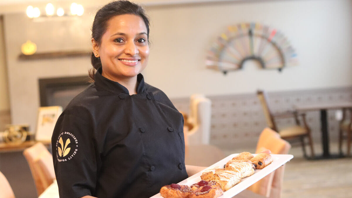 Pastry chef displaying tasty treats at the Sherwood community