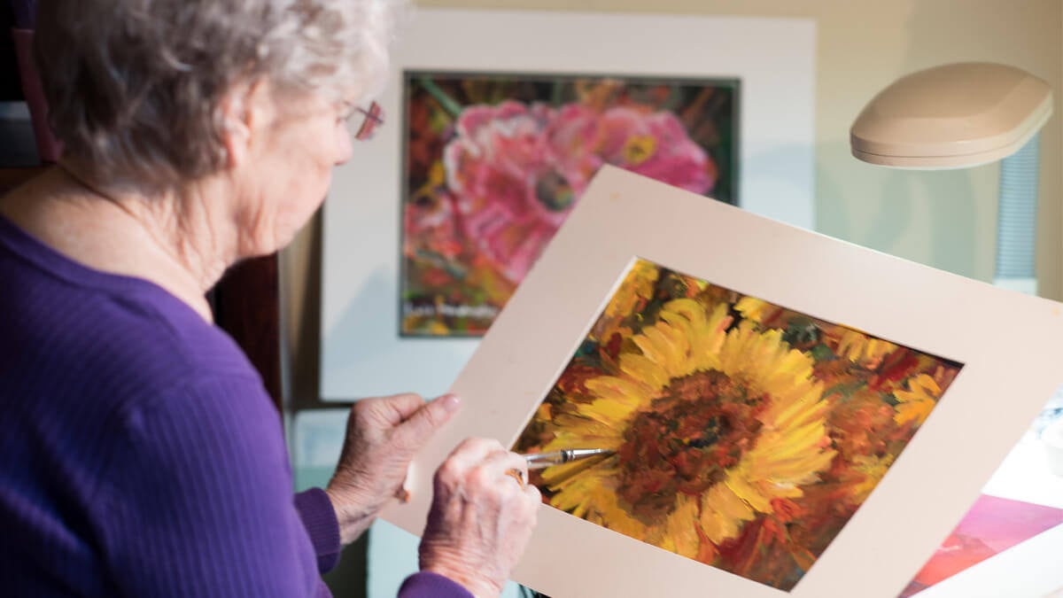 Resident painting at the Grand Park community