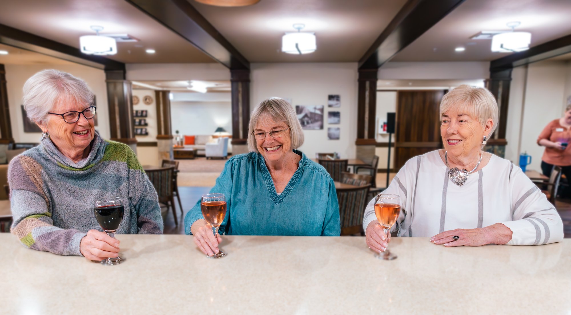 Older women talking and having drinks