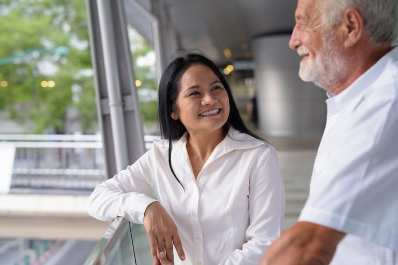 mature-multi-ethnic-couple-happy-and-in-love-while-discussing-retirement-and-senior-living